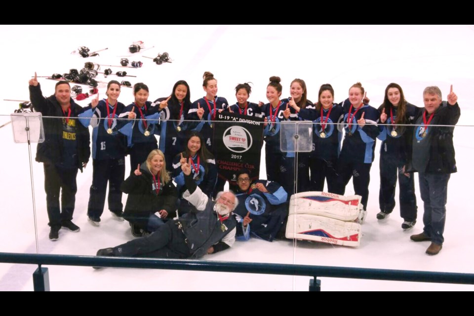 Richmond Ringette’s U-19 team pose with their gold medals in Kelowna. The team was marooned overnight on the notorious Coquihalla Highway between Hope and Merritt, due to freezing rain, en route to the event. The tournament organizers also awarded the team’s bus driver (front) a medal for getting the girls there safely.