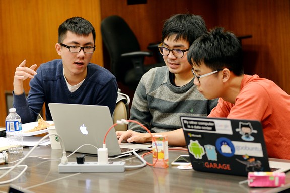 From left, Daniel Lin, Paul Nawattranakul and Napon Taratan teamed up to develop an app during the hackathon at city hall on Feb. 25 and 26, one of the activities at the weekend’s Hack Our City event.