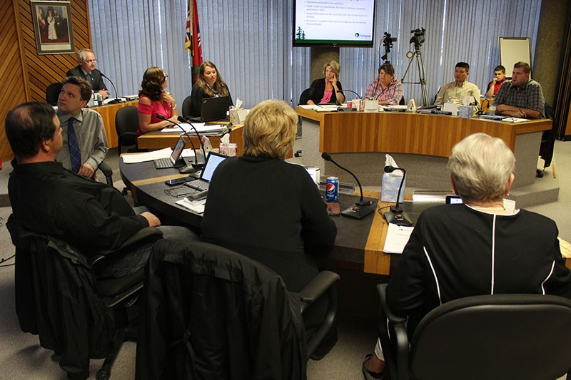 Members of the current Thompson city council take up residence at City Hall last July 17.