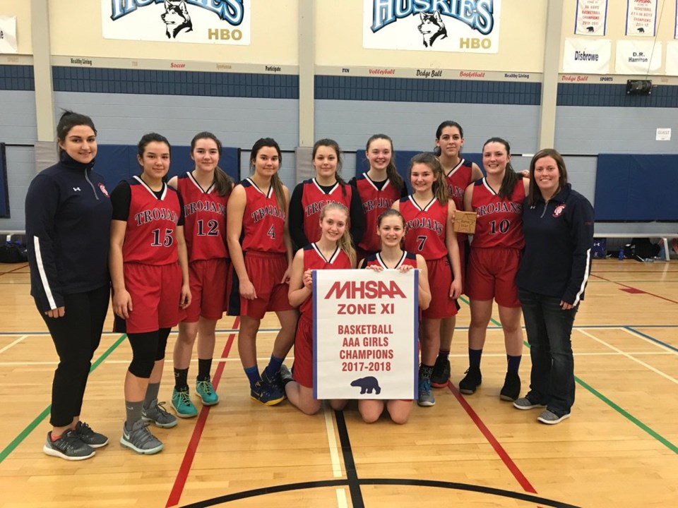 R.D. Parker Collegiate’s senior girls’ basketball team poses after winning the Zone 11 championships