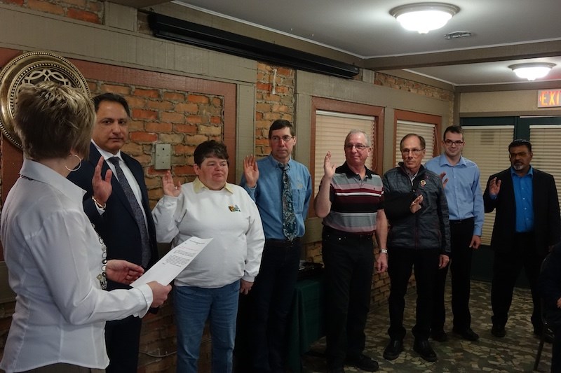 From left to right, Coun. Kathy Valentino swears in president Raj Thethy and directors Colleen Smook, Dave Moore, Dennis Green, Volker Beckmann, Duncan Regier and past president Oswald Sawh at the Thompson Chamber of Commerce annual general meeting March 21.