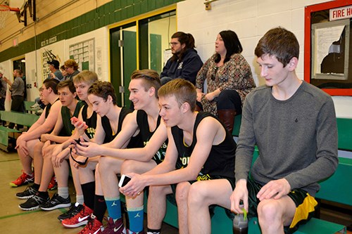 Boys advance to regionals basketball