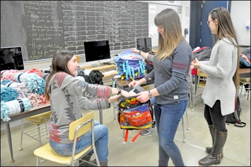 Items stuffed into the backpacks include toothpaste,  toothbrush, nonperishable snack, blankie, stuffie, drinking box, flashlight, and small toy or book. They will be stored at the RCMP detachments in North Battleford and dispersed by North Battleford Social Service to children of various ages.