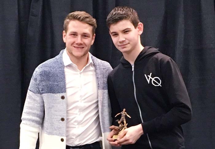 Male athlete of the year Austin Thomas (right) receives his award at the Gallagher Centre from Brett Levis (left).