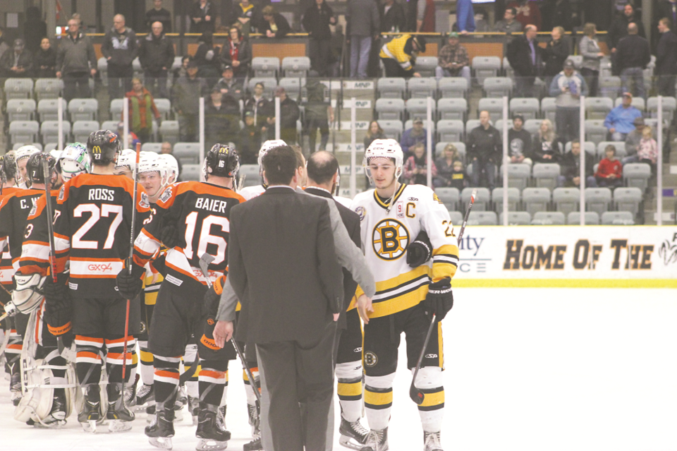 Hunter Piche sneaks past a Yorkton defender to get a loose puck during the midget AA Bruins 2-1 loss