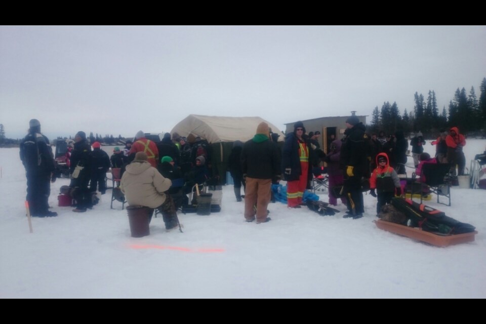 Avid fishermen gathered on the ice prior to the beginning of the Nelson Lake ice fishing derby on March 18.