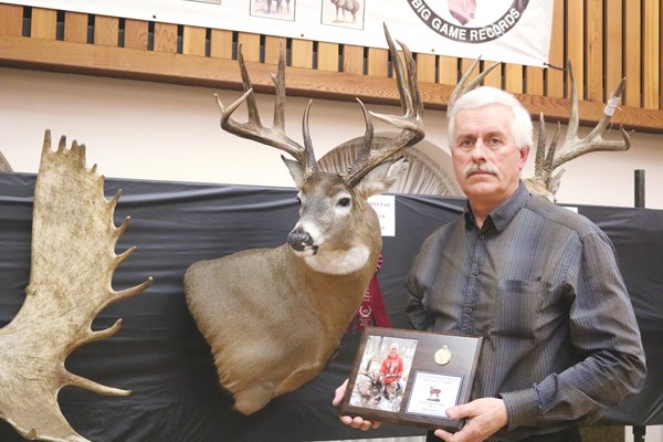 Yorkton’s Brian Nielsen with his first place typical whitetail deer and award.