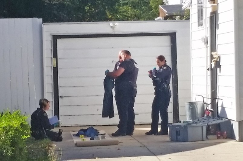 Police tag and bag evidence September 22, 2016 at a residence on Fourth Avenue in Yorkton during the investigation into the September 13 murder of 67-year-old Lawrence Skoretz.