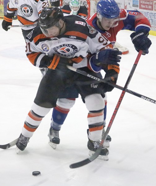 Spy Hill native Dakota Odgers shows his rough and gritty game against the highway 10 rivals, the Melville Millionaires, at the Farrell Agencies Arena.