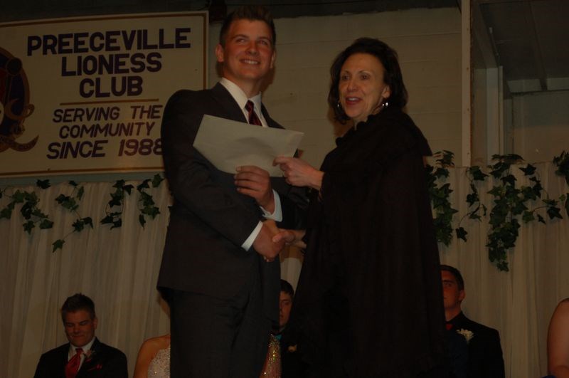 Graduate Lee Schutte received the Preeceville Community Council Scholarship. Sheila Klebeck made the presentation.