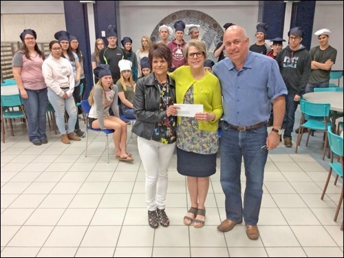 Students from North Battleford Comprehensive High School’s Commercial Cooking program had a big cheque to present to the Canadian Mental Health Association after their Taste of Food cook-off event. On Tuesday, a cheque was presented for $1,200, which is being matched by a personal $1,200 donation from Rob Rongve for a $2,400 total. Seen here at the cheque presentation are commercial cooking teacher Janice Staff, Jane Zielke de Montbrun of the Canadian Mental Health Association, and Rob Rongve, who is active on their building campaign. Photos by John Cairns