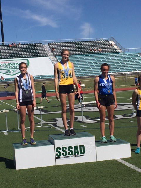 Kelsey Haczkewicz, shown here in grey, is ending her high school track and field career with five medals before she continues on to the University of Regina.