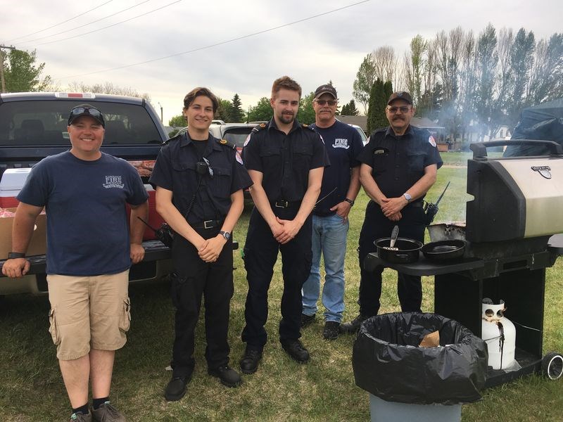 Among the Kamsack EMT and fire fighters who manned the barbecue for the second annual SADD community ball games event on June 2, from left, were: Darcy Green, Daylen Bohyer, Dillon Chernoff, Bruce Thomsen and Ken Thompson.