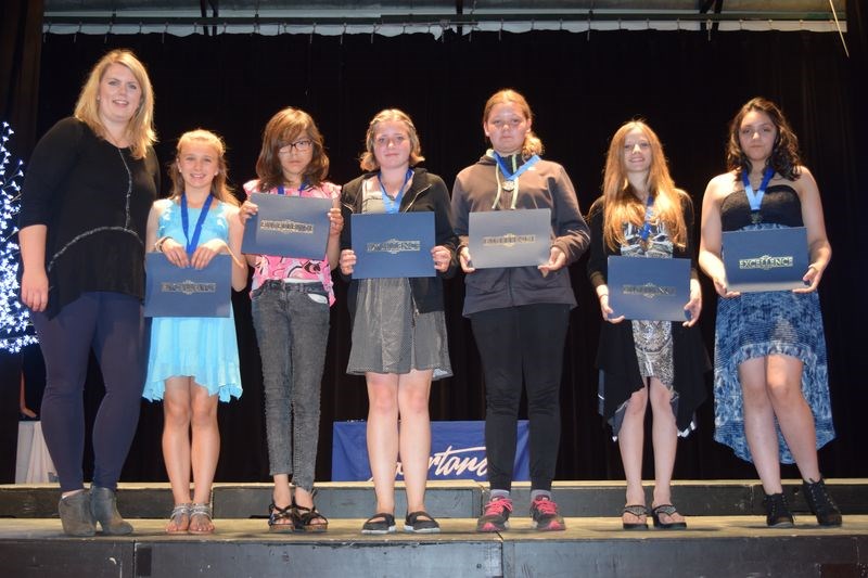 Bethany Brade, left, presented the Art Smart Award, from left, to: Sienna Koroluk, Taliyah Cote, Megan Raffard, Cadence Severight, Zerlina Buchan and Aura Whitehawk.