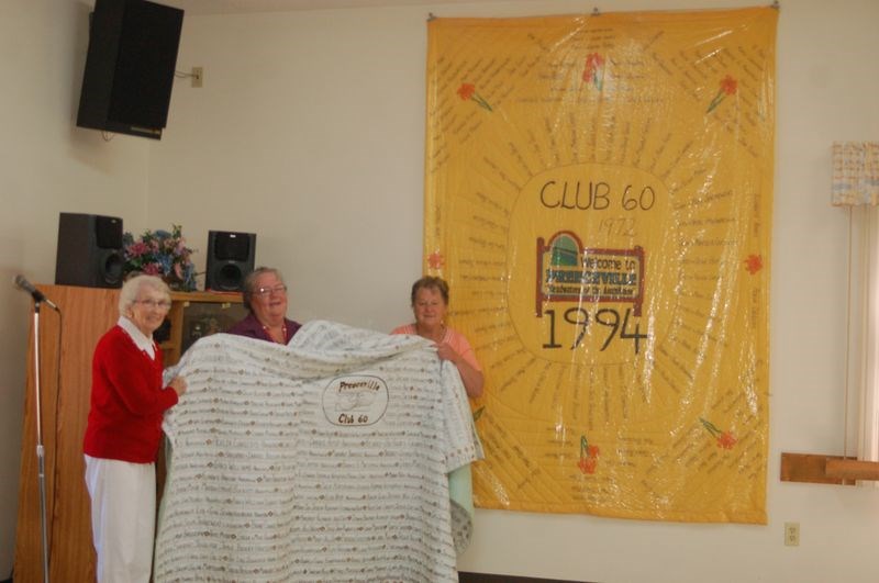 Lorene Biccum, left, Maureen Johnson and Marj Bodnar displayed both quilts that were part of the world’s largest quilt registered in the 1995 Guinness Book of World Records.