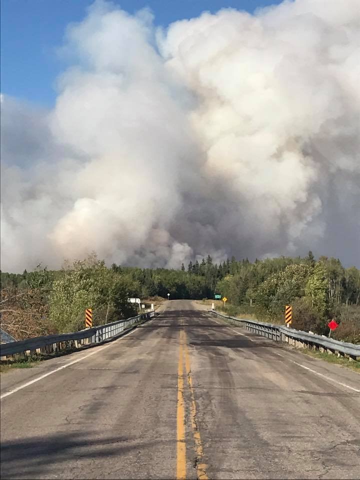 Smoke visible over Highway 106 south of Birch Portage.