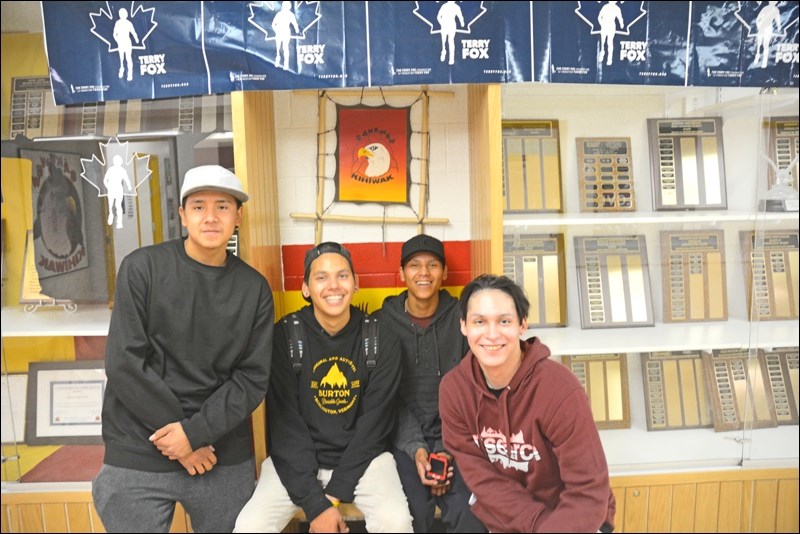 “Yo, can you take our photo?” Darion Starr, Jackson Chakita, Greysin Moccasin-Nahbexie and Dylan Poitras.