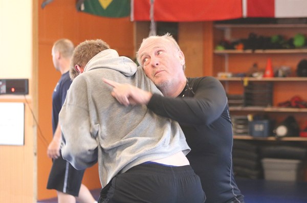 Leo McGee works with one of Yorkton’s wrestlers.