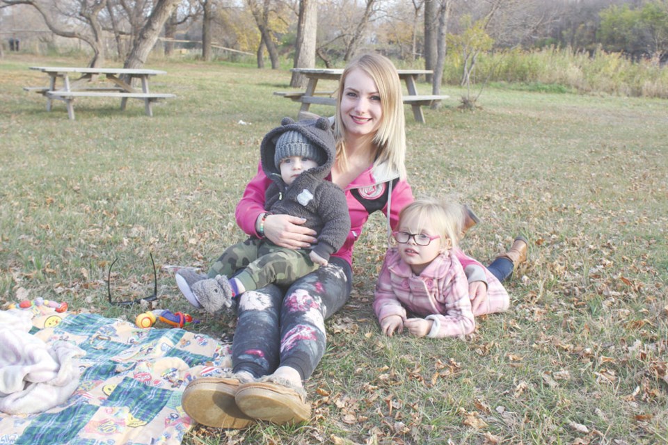 From left, Jaycey Tosh, Asher Meriam and Presley Anderson relaxed at Woodlawn Regional Park.