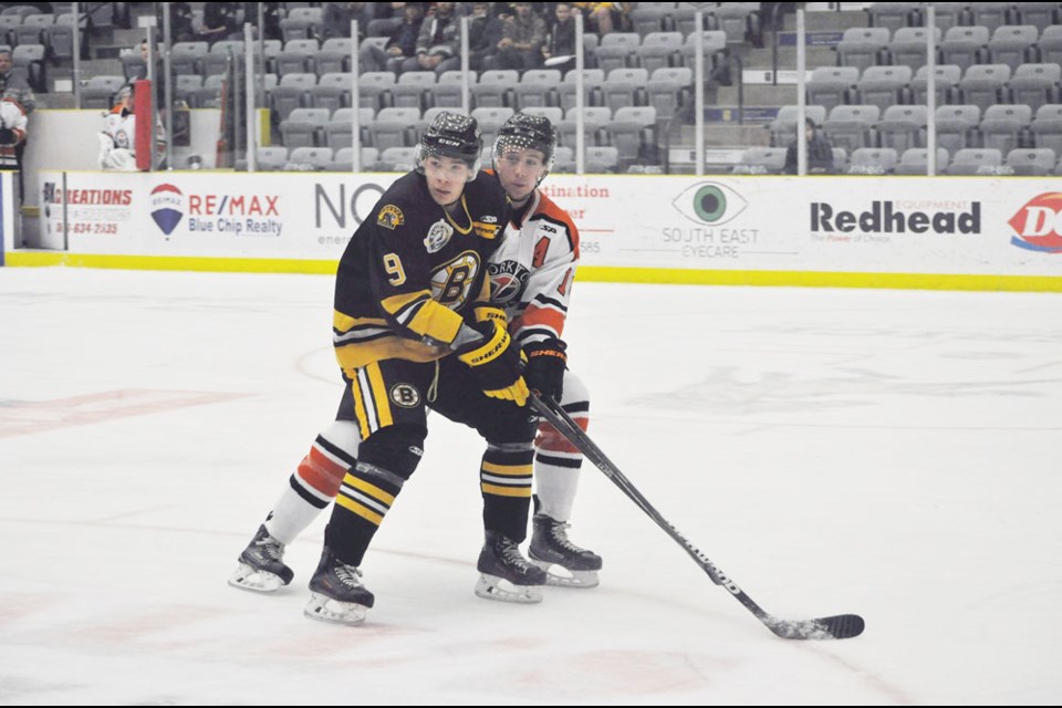 Estevan's Hayden Guilderson battles with Yorkton's Kyle Sargent on the way to the slot.