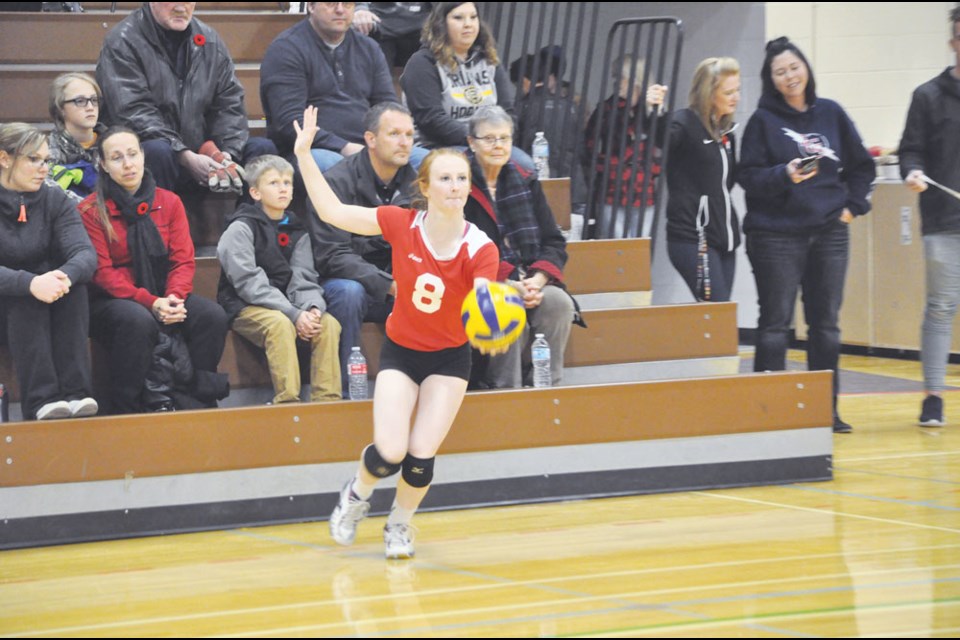 Elecs' Jenna Blanchette gets ready to serve.