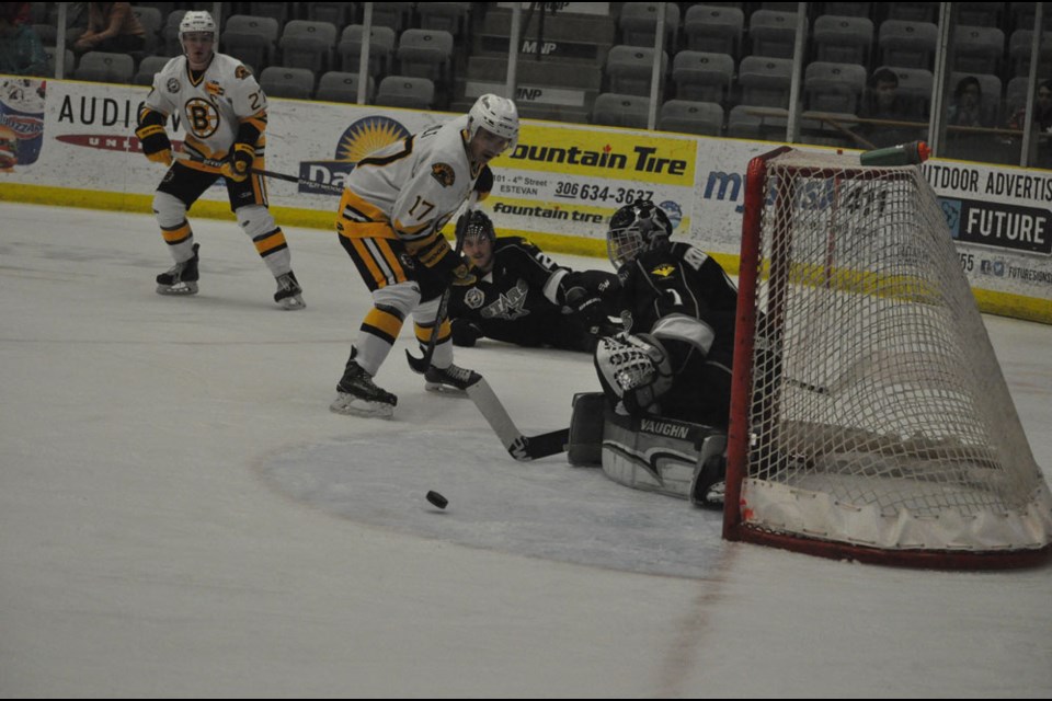 Power Dodge Estevan Bruins forward Kaelan Holt looks for a rebound against Battlefords goaltender Taryn Kotchorek Friday at Affinity Place.