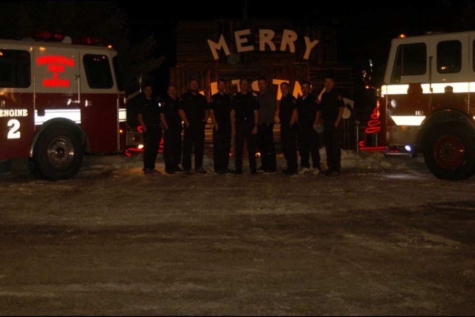 Some of the members of the Preeceville Volunteer Fire Department posed for a Christmas photograph with the department’s new fire truck.