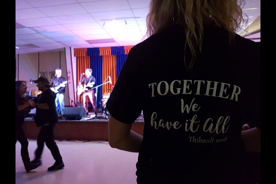 Members of Tim Thibault's family and support system all wore special shirts for the ‘Boldt-Hemian Rhapsody Cabaret on Jan. 6. Shirts read, "We may not have it all together, but together we have it all." Kristen Thibault fashioned the back of the shirt while Codie Prevost played in the back ground. Photo by Becky Zimmer