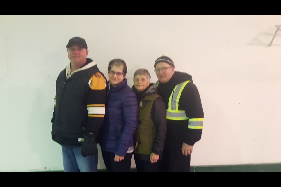 Members of the team that won the first event of the Arran Mixed Open Bonspiel January 22 to 28, from left, are: Rick Kinaschuk, skip; Lenore Kinaschuk, third; Pat Lyons, second, and Tom Lyons, lead.