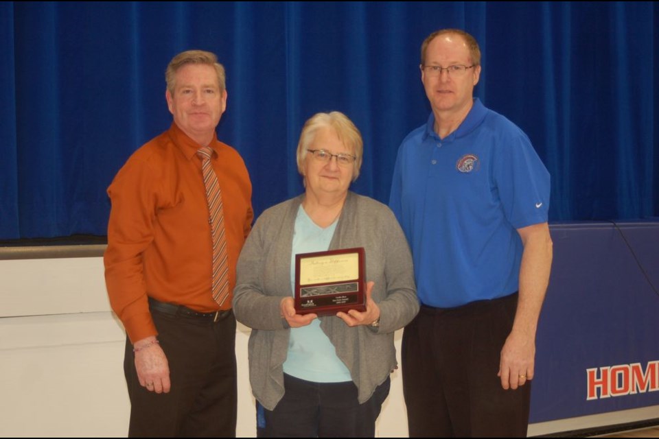 Cecilia Sliva of the Sturgis Composite School received the Sea Star Award during the staff appreciation week in Sturgis. From left, were: Mark Forsythe, Superintendent of Education, Sliva and Brad Cameron, principal.