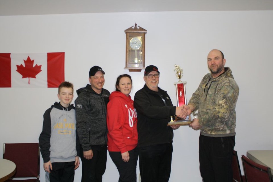 The Dale Crozier rink won the Endeavour open bonspiel. Scott Giddings made the presentation. From left, were: Trever Geistlinger, Russell Gesitlinger, Shannon Geistlinger, Crozier and Giddings.