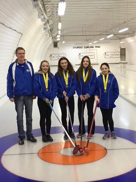 Members of the KCI junior girls curling team, from left, are: Scott Tulloch (coach), Kate Herhardt, Chloe Koroluk, Anna Schwartz and Leah Schwartz.