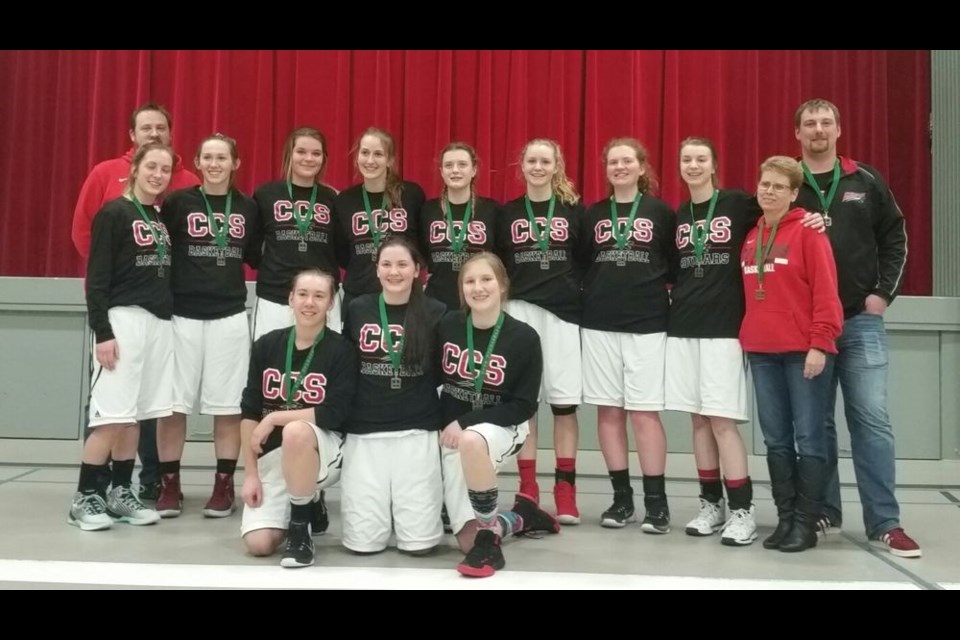 The Canora Cougars senior girls basketball team finished first in its conference playoff tournament in Kelvington on March 10. From left, wearing their gold medals, are: (back row) Curtis Baillie (coach) and Steven Wyonzek (assistant); (middle) Jill Gulka, Janayah Merriam, Rebekah Thomas, Mackenzie Gulka, Megan Barteski, Ashley Stusek, Jordelle Lewchuk, Emma Eiteneier and Lorraine Gress (assistant); and (front) Ally Sleeva, Felicity Mydonick and Emma Mykytyshyn.