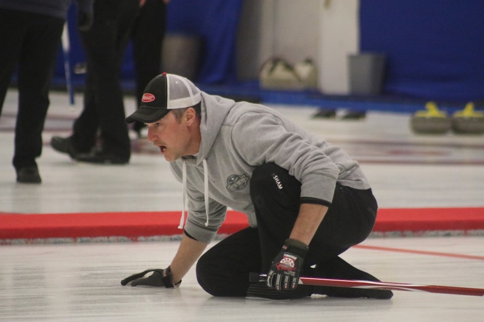 Hurry hard. A third instructs his team how to guide a rock to victory during the final day of the bonspiel.