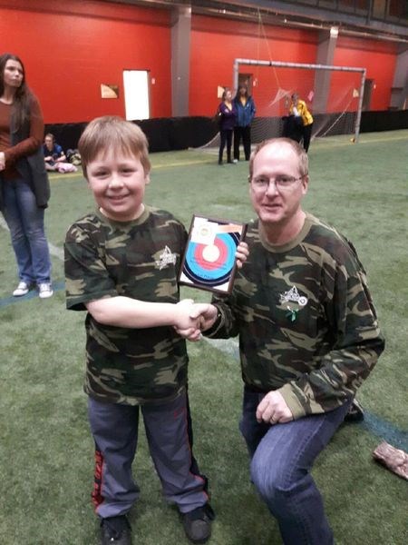 Carter Scheller of the Sturgis Archery Club won first in the archer division of the Saskatchewan Archery Association Junior Olympic Program and Age class championships in Prince Albert on April 14. With Scheller is Brad Cameron, coach.