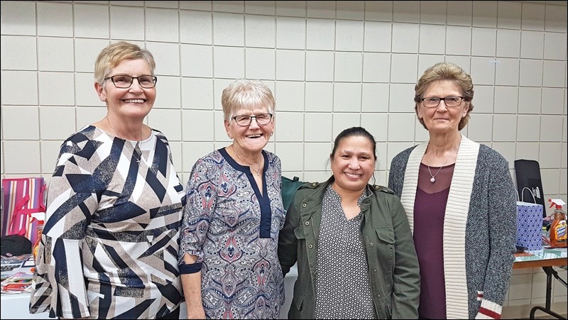 Celeste Bridgeman, Heartland Health volunteer co-ordinator, stands with volunteers Leona Gumpinger, Mely Biri and Mary Bohn, who helped her pull together the annual volunteer recognition night April 25.