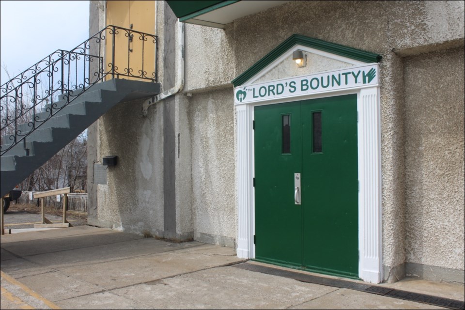 The new entrance of the Lord’s Bounty Food Bank has been completed. On April 30, unknown vandals smashed a window and threw a rock at the doors, but volunteers came within 24 hours to fix the door and window free of charge. - PHOTO BY ERIC WESTHAVER