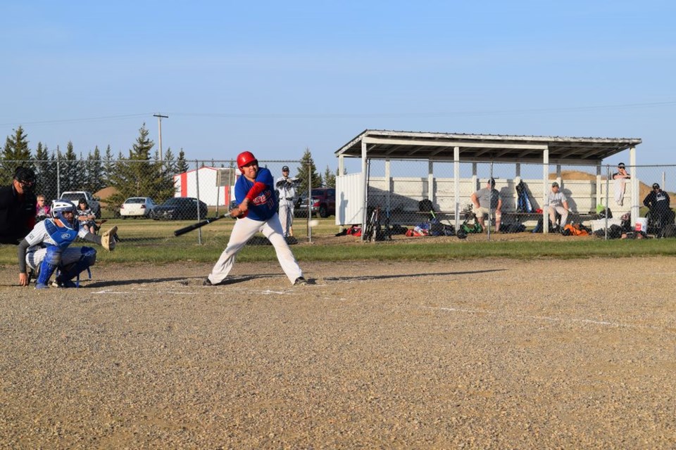 Ian Quewezance of the Canora Supers found a way to reach this outside pitch and drove a single to the outfield during the opening game of the season on May 14 against the visiting Yorkton Yankees.