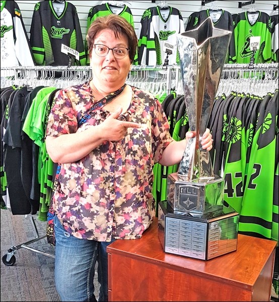 As Saskatchewan Rush season ticket holder, Sherri Solomko stopped in the Rush office the morning of June 21 and got up close and personal with the championship cup won June 9. The cup has been making stops around the province with a variety of players. The Rush were moved from Edmonton after they won this cup in 2015. In their first year in Saskatchewan, they captured the 2016 championship at home. In 2017, they lost the final to the Georgia Swarm but they would not be denied in 2018 as they captured the series with the Rochester Nighthawks giving them their third NLL title in four years. Photo submitted by Sherri Solomko