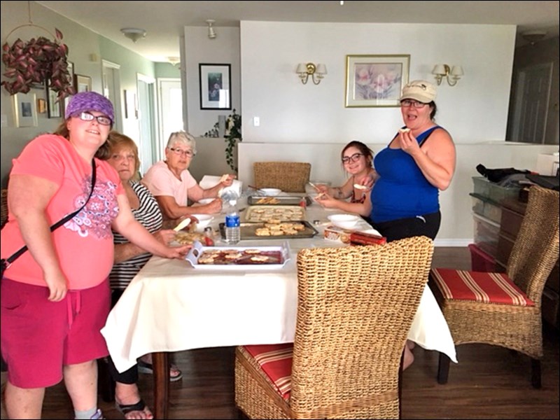 Volunteers making cookies for the Meota Canada Day party at the park are Jess Skuce, Vivian Skuce, Vi Cardinal, Sam Kachur and Denise Skuce. Photo by Lorna Pearson