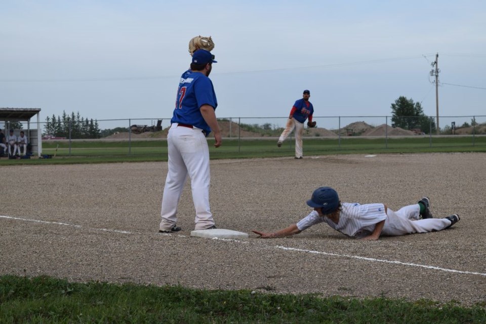 The Brewers runner dove in just ahead of a pickoff attempt from Supers pitcher Kholton Shewchuk to first baseman Adam Korb.