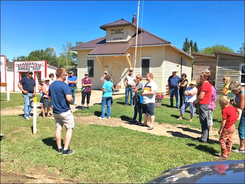 Graham Sargent speaking to some of those joining in the Borden Museum Historic Walking tour Sunday. Photos by Lorraine Olinyk