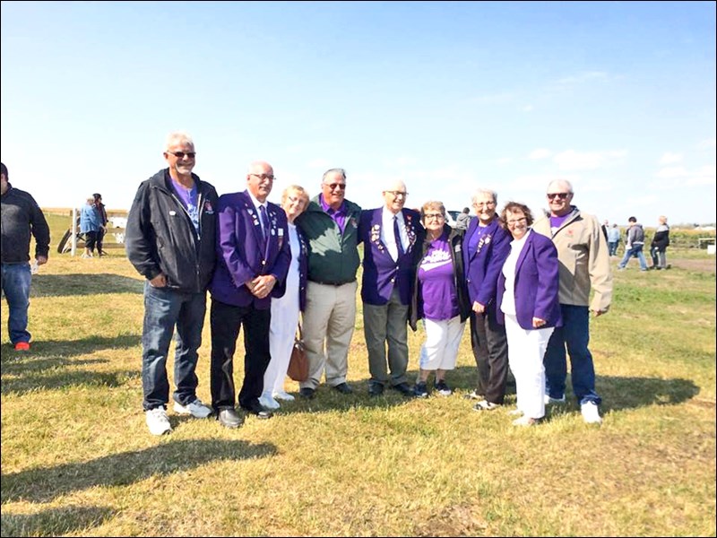 Eugene Hartter of Wilkie, and president of the Saskatchewan Elks, Chris Scouler, owner of the Bull Dog Corn Maze and member of the Cut Knife Elks Lodge, and Ron Potter of Moosomin, former president of the Saskatchewan Elks, at the official opening, Sept. 2, of the Elks corn maze. Photos by Helen Urlacher