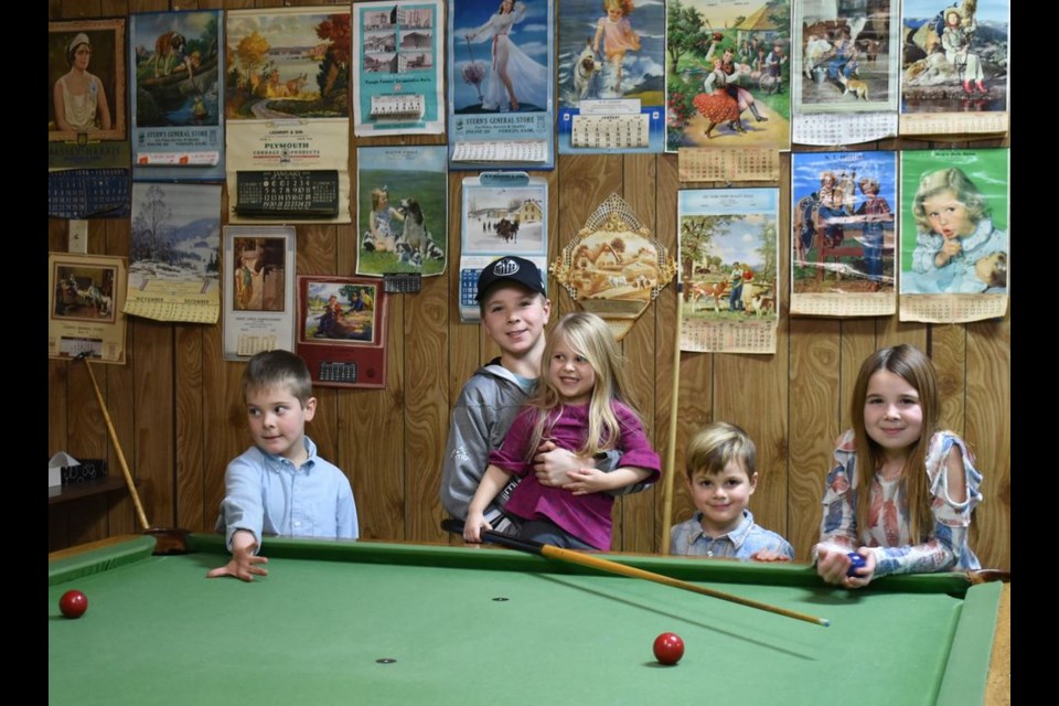 The younger ones enjoyed playing pool at the Veregin Hall fundraiser supper.