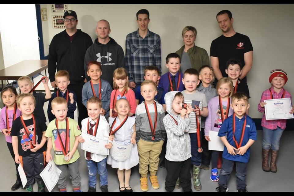 The IP (initiation program) group, from left, were: (back) Jeff Smandych, assistant coach; Kevin Kitchen, head coach; Ethen Krawetz, assistant coach; Amanda Hunter, team manager; Ryan Gareau, assistant coach, and (middle) Inez Keshane, Preston Shabatoski, Crosby Miller, Houston Keshane, Sierra Vidomski, Luke Walter, Archie Sumner, Bryden Leis, Nixon Shabatura, Morgan Lawless, Chase Allen and Ezerae Grieve, and (front) Xander Gareau, Emmett Kitchen, Nate Bedore, Madelyn Lorenzo, Brodie Hunter, Emmett Marsh and Axel Shabatura.