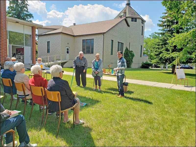 At Unity United Church’s annual outdoor service, held the last Sunday in June, retired Reverend George Ward was recognized for 50 years with the United church of Canada while retired Reverend Louise Robson was acknowledged by the United church of Canada for her 25 years of service. Certificates were presented by Unity United Church’s serving minister, Gary Johnson. Following the outdoor worship service, a picnic was enjoyed. Photo submitted by Sherri Solomko