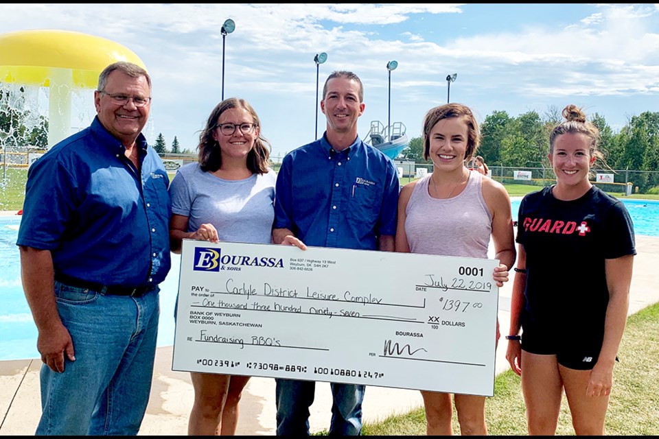 E. Bourassa & Sons in Carlyle held community barbecues on June 27 and July 18. $1,397.00 was raised from both barbecues and was presented to the Crescent Point Leisure Complex in Carlyle. (L-R) Dennis Steele (Carlyle Bourassa Store Manager), LaTonya McLean (Leisure Complex Vice President), Kurtis Bourassa (Bourassa General Manager), Erica Nistor (Leisure Complex President), Renae Fafard (Leisure Complex Manager).