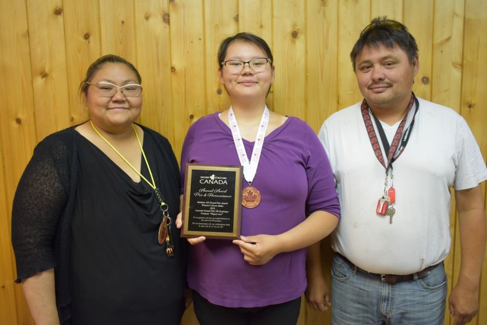 Novice local archer wins national award Lilyanna Quewezance, standing with her parents Lenora and Alvin Quewezance, showed off her 3-D Grand Prix award and bronze medal which she won in Prince Albert recently at the Outdoor 3-D Archery Canadian Championships sponsored by the Timberland Bowbenders Archery Club. A member of the Kamsack River Valley Archery Club (RVAC), Lilyanna has only been shooting for around nine months.