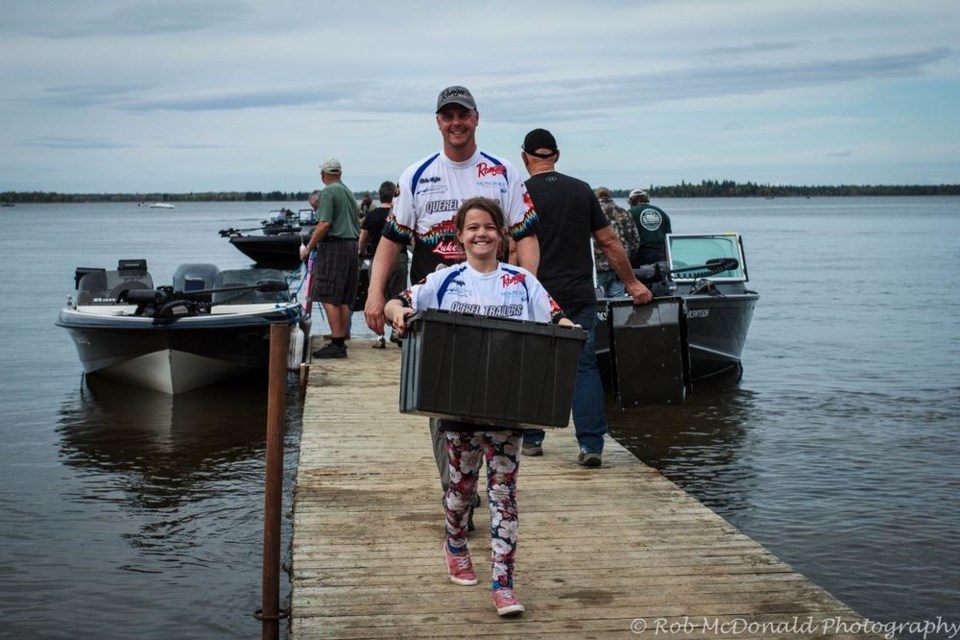 It was “a beautiful day for fishing” on Madge Lake as fish were brought in for measuring