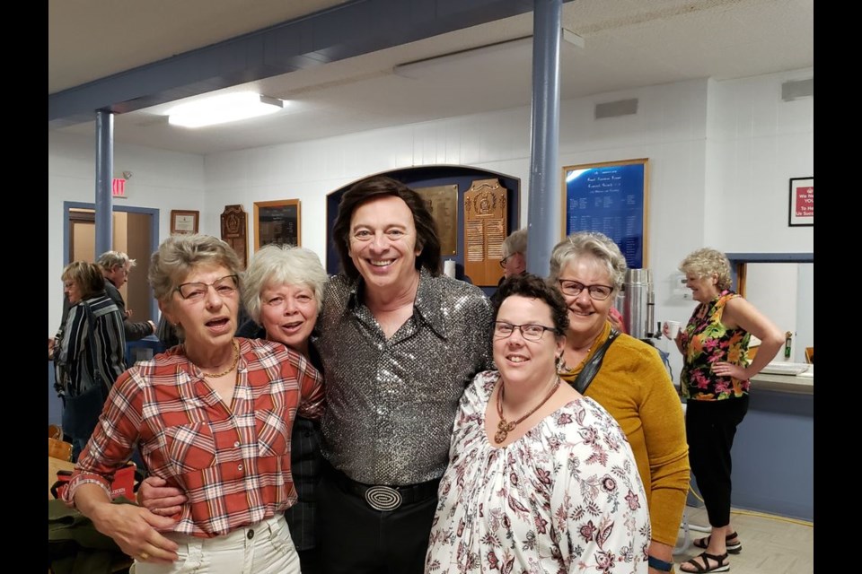 From left, fans of the Neil Diamond tribute artist Jason Scott who gathered for a post-concert photo, were: Vera Kuzma, Marie Toy, Scott, Keri Lindsay and Judy Green.